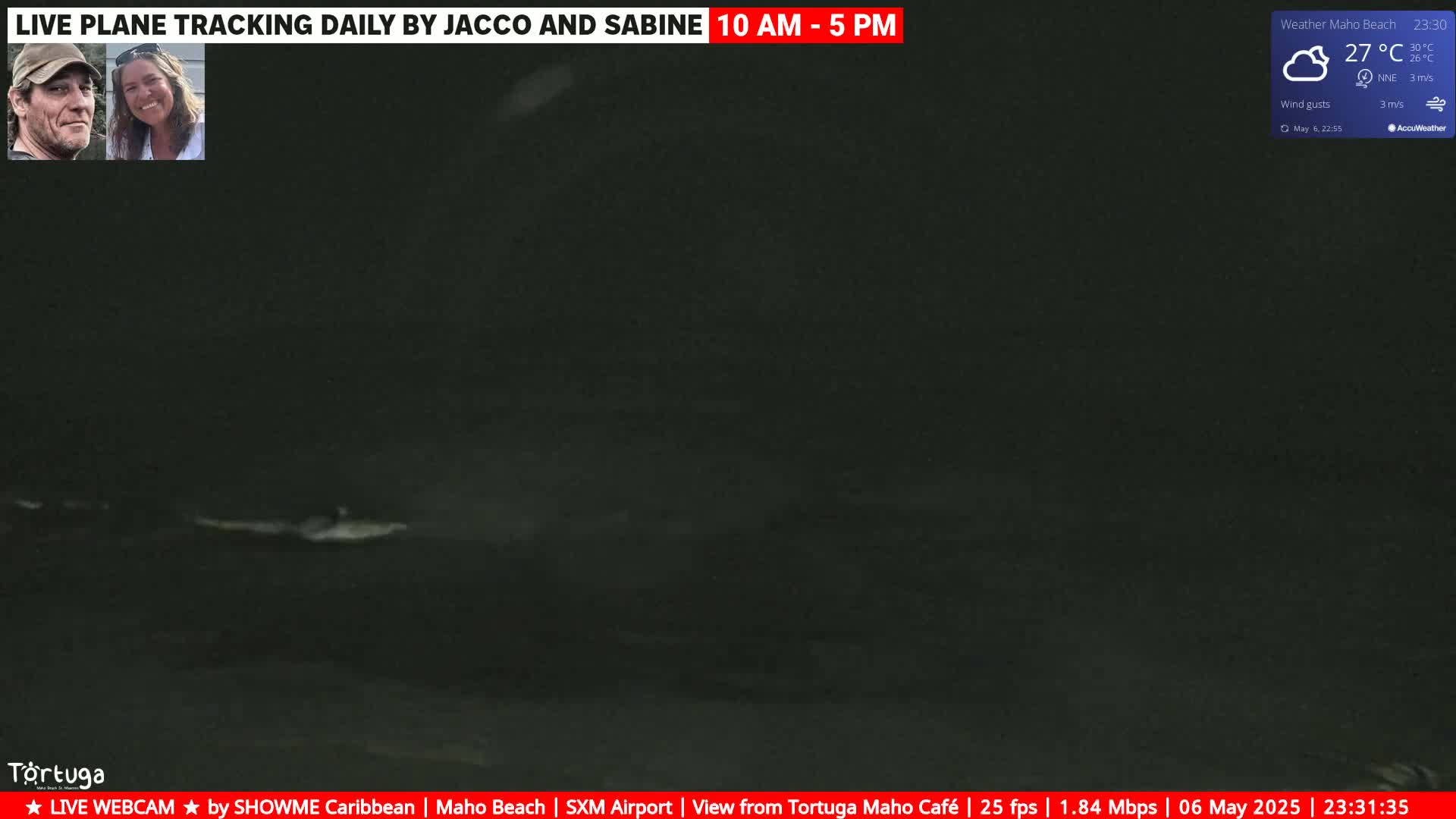 A nighttime, dark ocean scene with slightly cloudy weather conditions is shown.