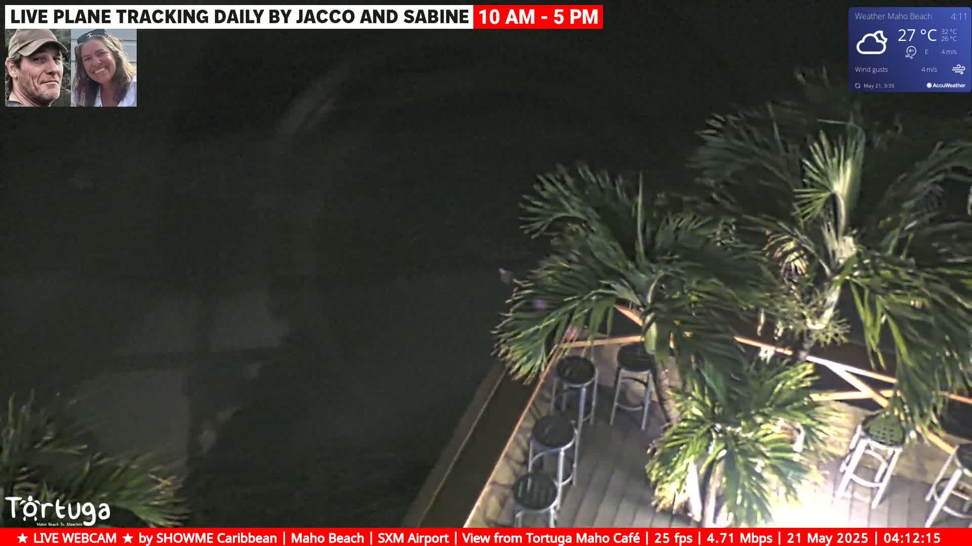 An outdoor nighttime scene shows palm trees surrounding empty bar stools on a deck under a partly cloudy sky, with a temperature of 27°C.