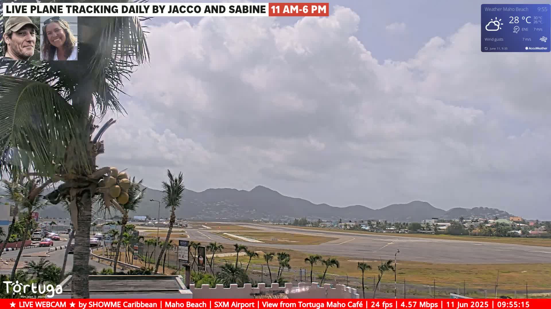 A partly cloudy day shows an airport runway with palm trees and distant mountains.