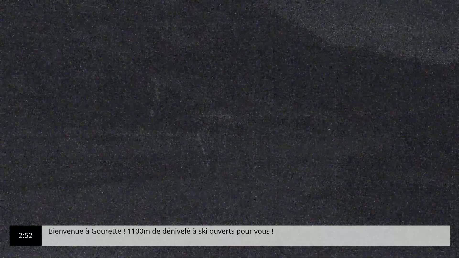 The image shows a grainy, dark screen displaying static.