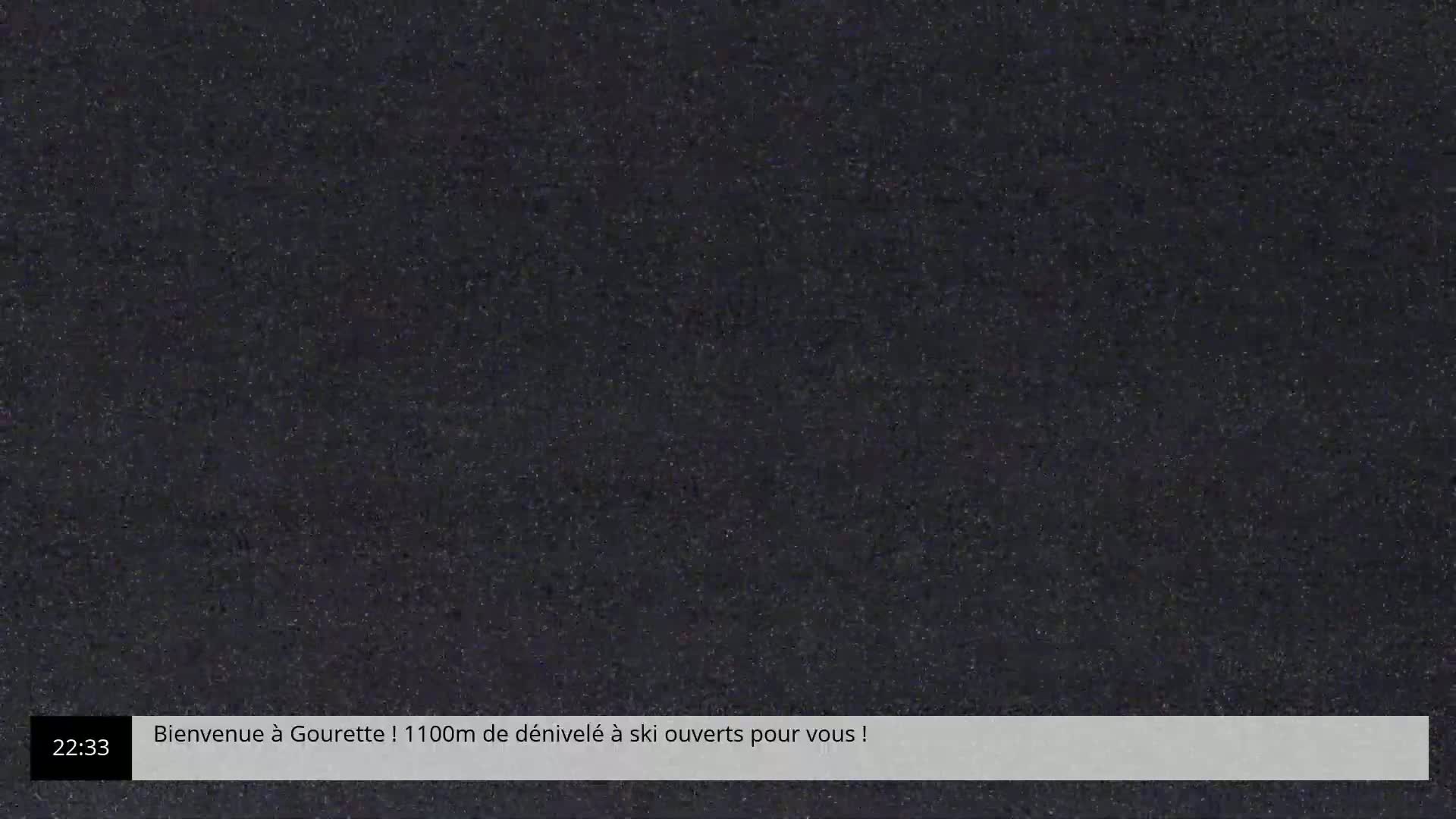 The image shows a dark, grainy screen displaying a static-like pattern.