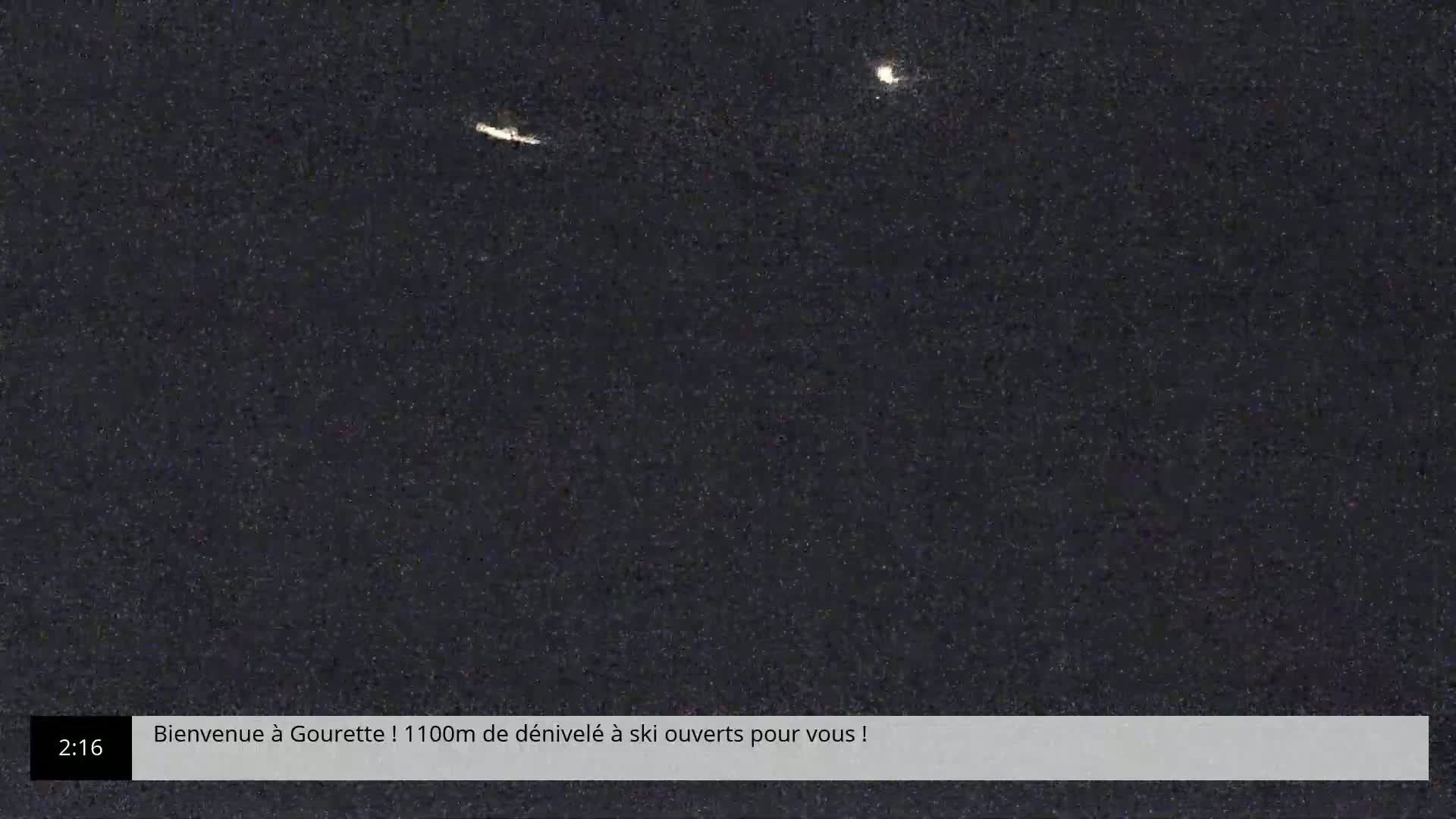 A night-time image shows a dark sky with two bright streaks, possibly satellites or meteors.
