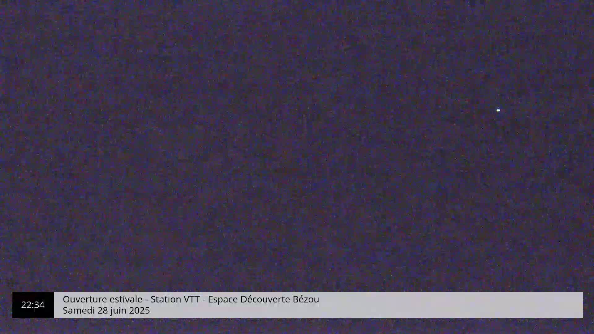 A single, bright point of light is visible in a dark, nighttime sky.