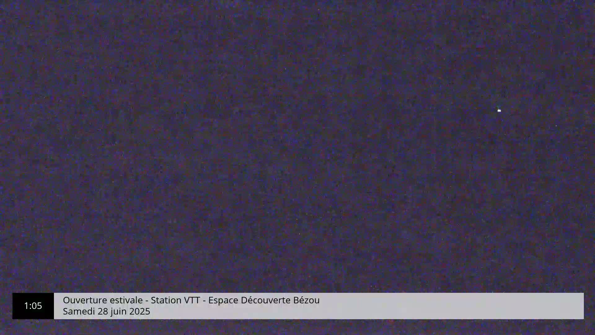 A single, bright star is visible in a dark, night sky.