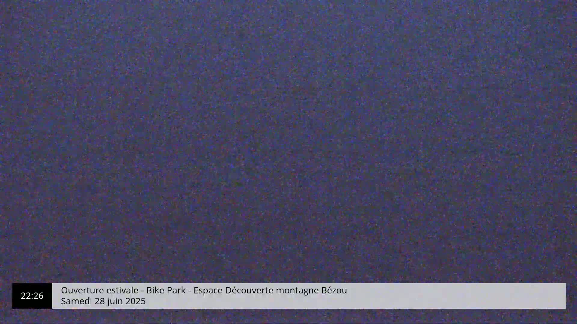 The image shows a solid, dark-blue screen filled with static.