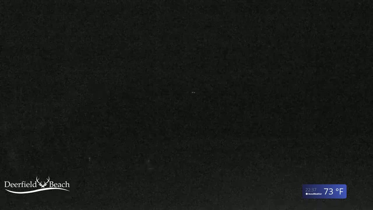 A dark, possibly nighttime, image shows a solid black background.
