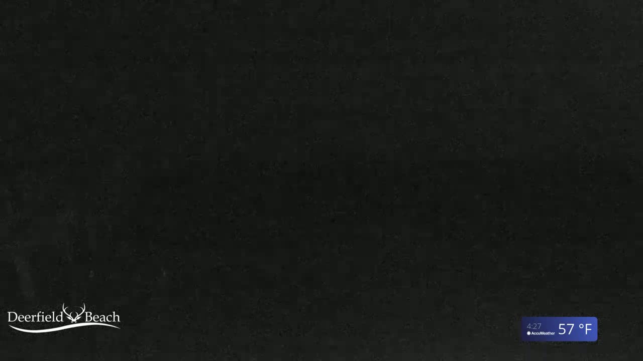 A dark gray or black textured surface is shown, with a temperature of 57°F displayed in the bottom right corner.