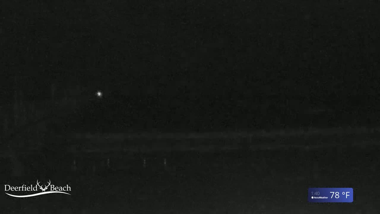 A dark, nighttime scene shows a dimly lit beach under a clear sky, with a temperature of 78°F.