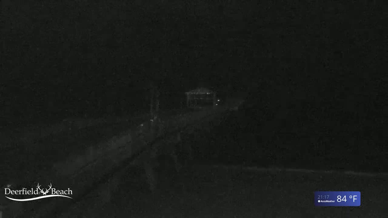 A dark, nighttime outdoor scene shows a dimly lit gazebo and a path leading to it, with a temperature of 84°F.