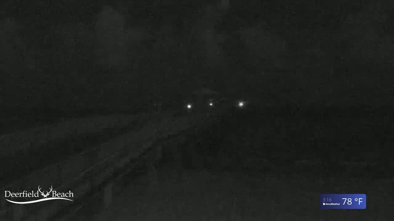 A dark, nighttime scene shows a road with a few distant lights under a cloudy sky, with a temperature of 78°F.