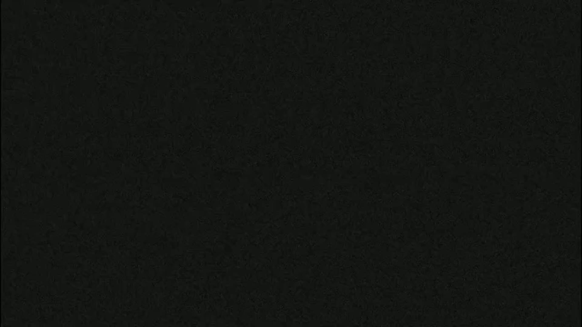 The image shows a uniformly dark gray-black textured surface.