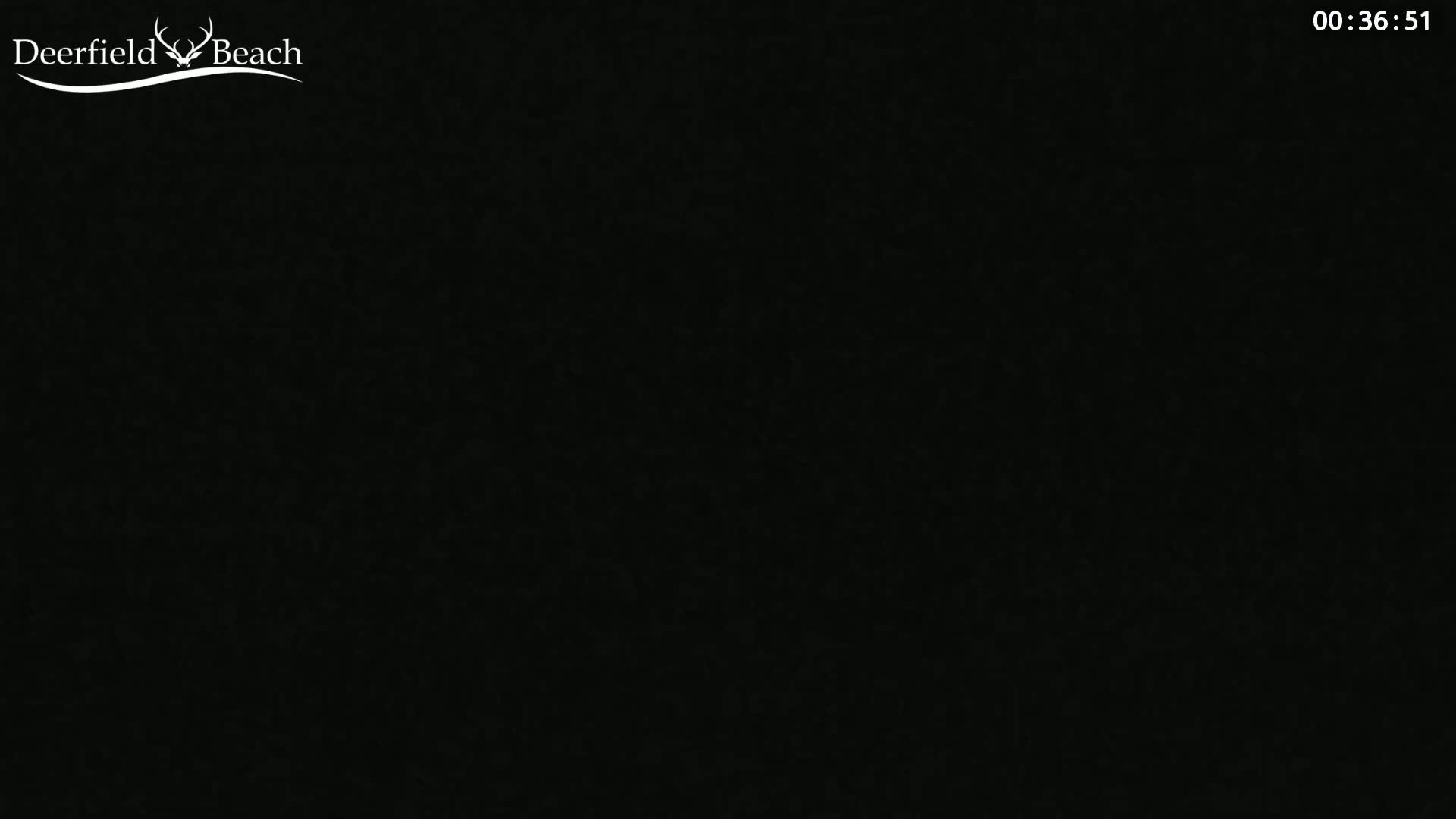The image is a completely black screen with a grainy texture.