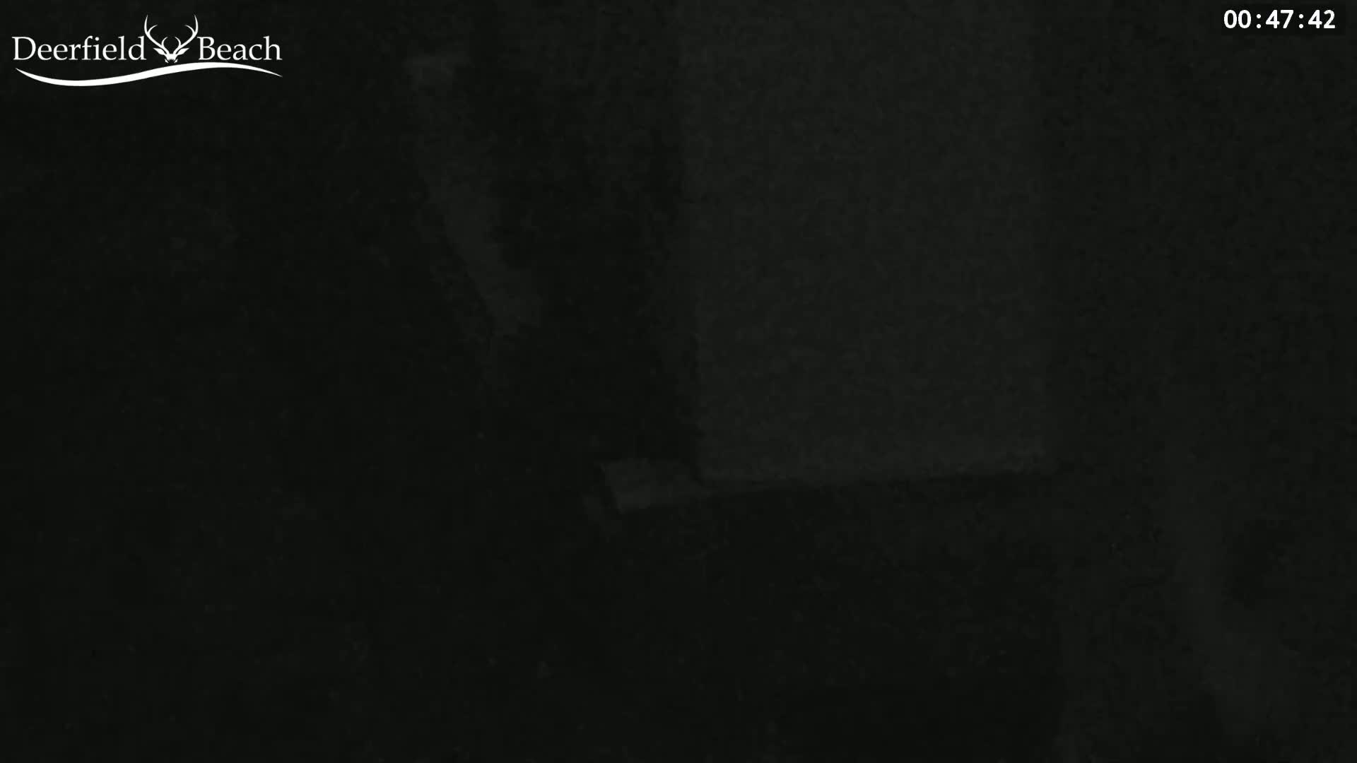 The image shows a very dark, possibly nighttime scene with little to no visible details.