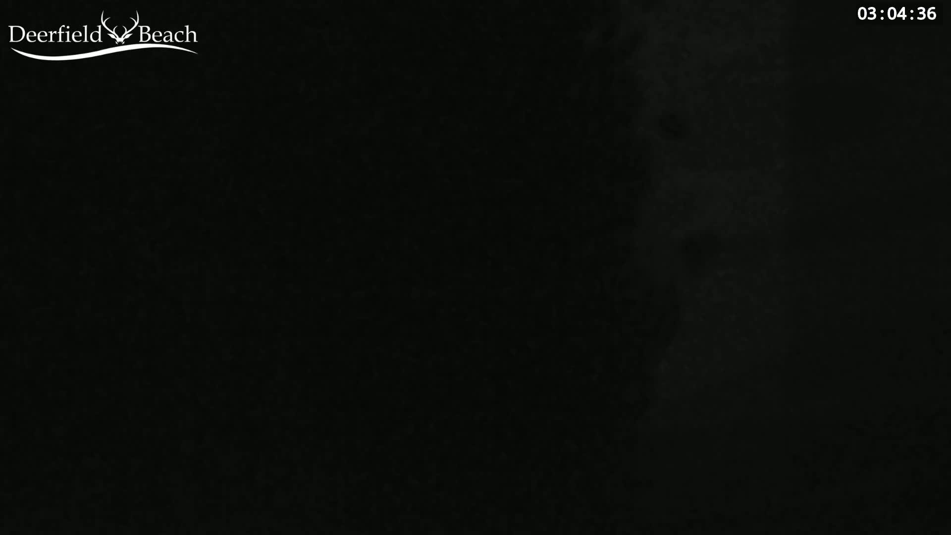 A mostly dark image shows a faint, hazy light on the right side.