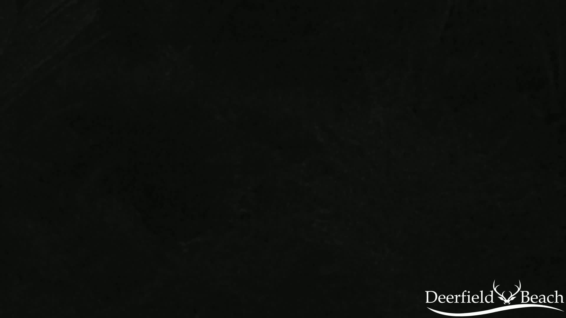 A uniformly dark gray-black textured surface fills the entire image.