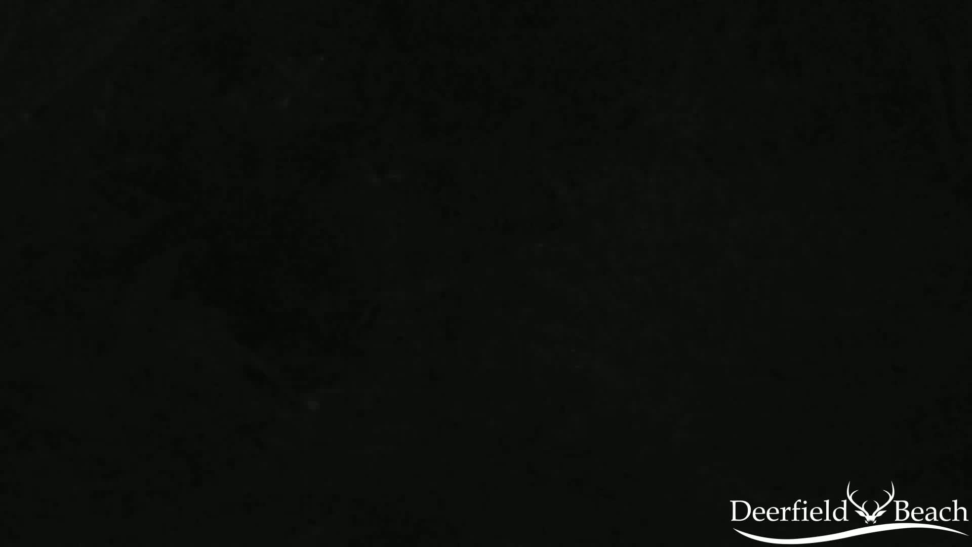 The image shows a solid black background with subtle variations in shading.
