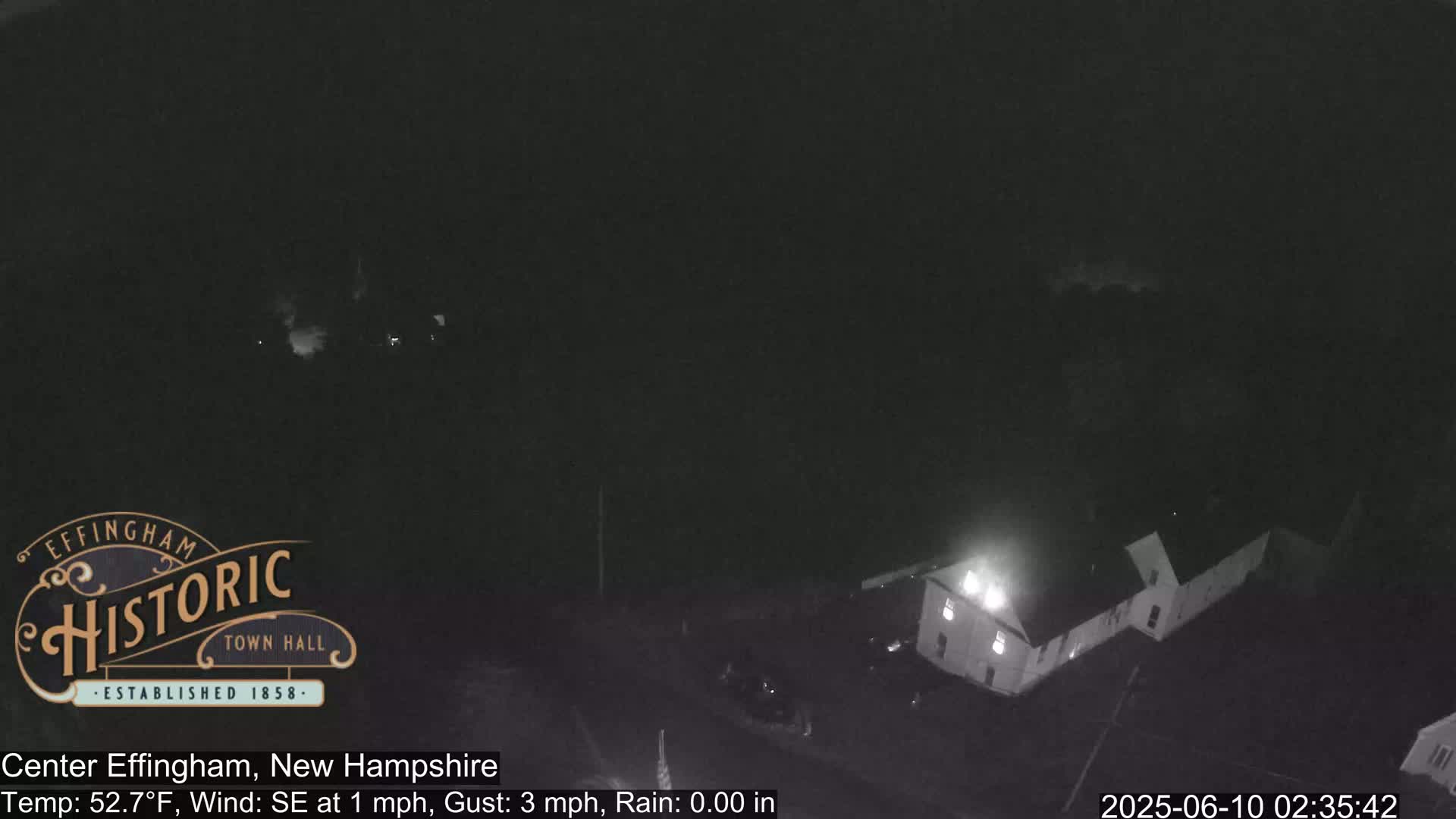 A nighttime, low-light view of a building, under a dark sky with a southeast wind of 1 mph and gusts up to 3 mph.