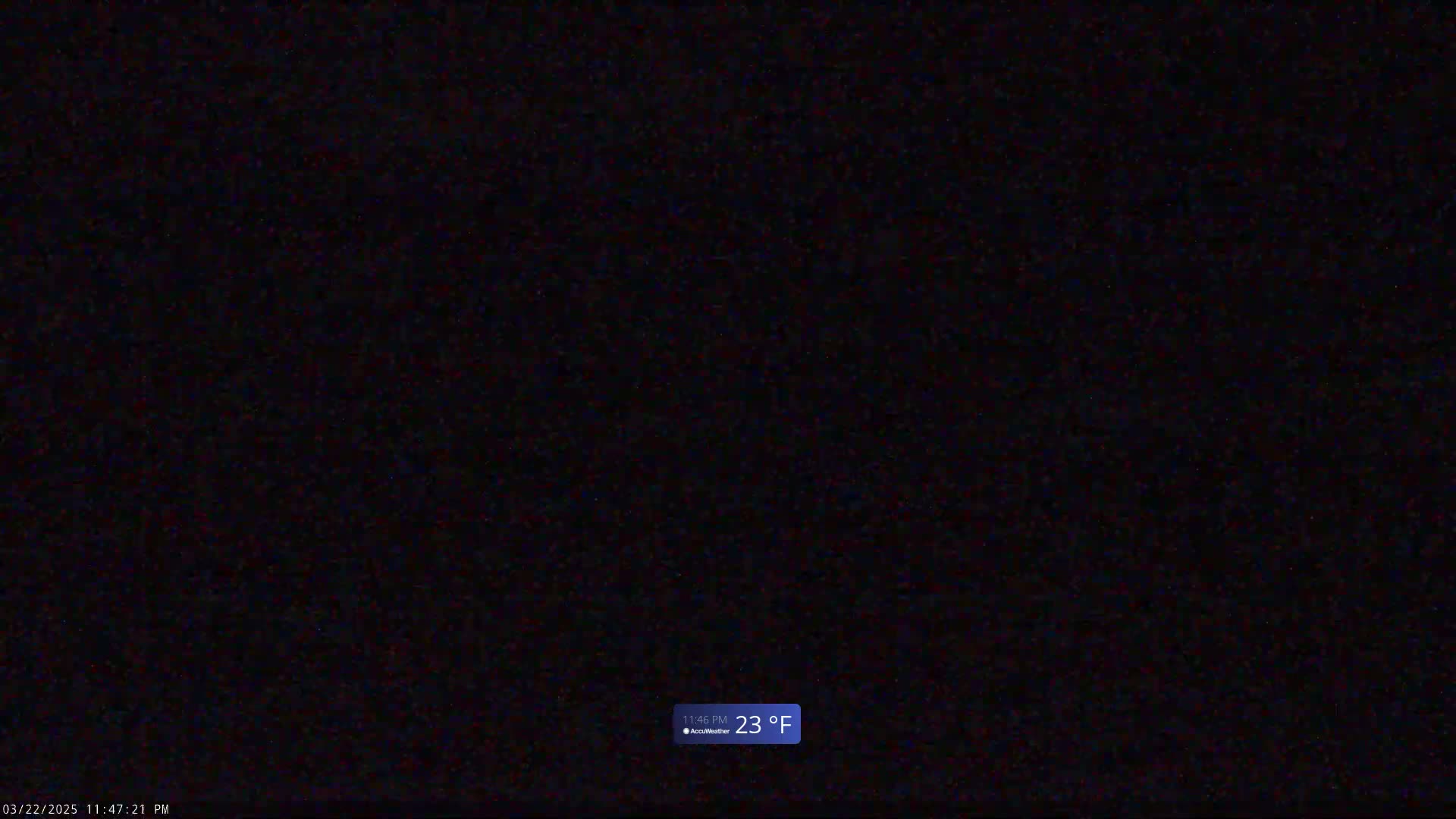 A completely dark nighttime scene shows a temperature of 23°F.