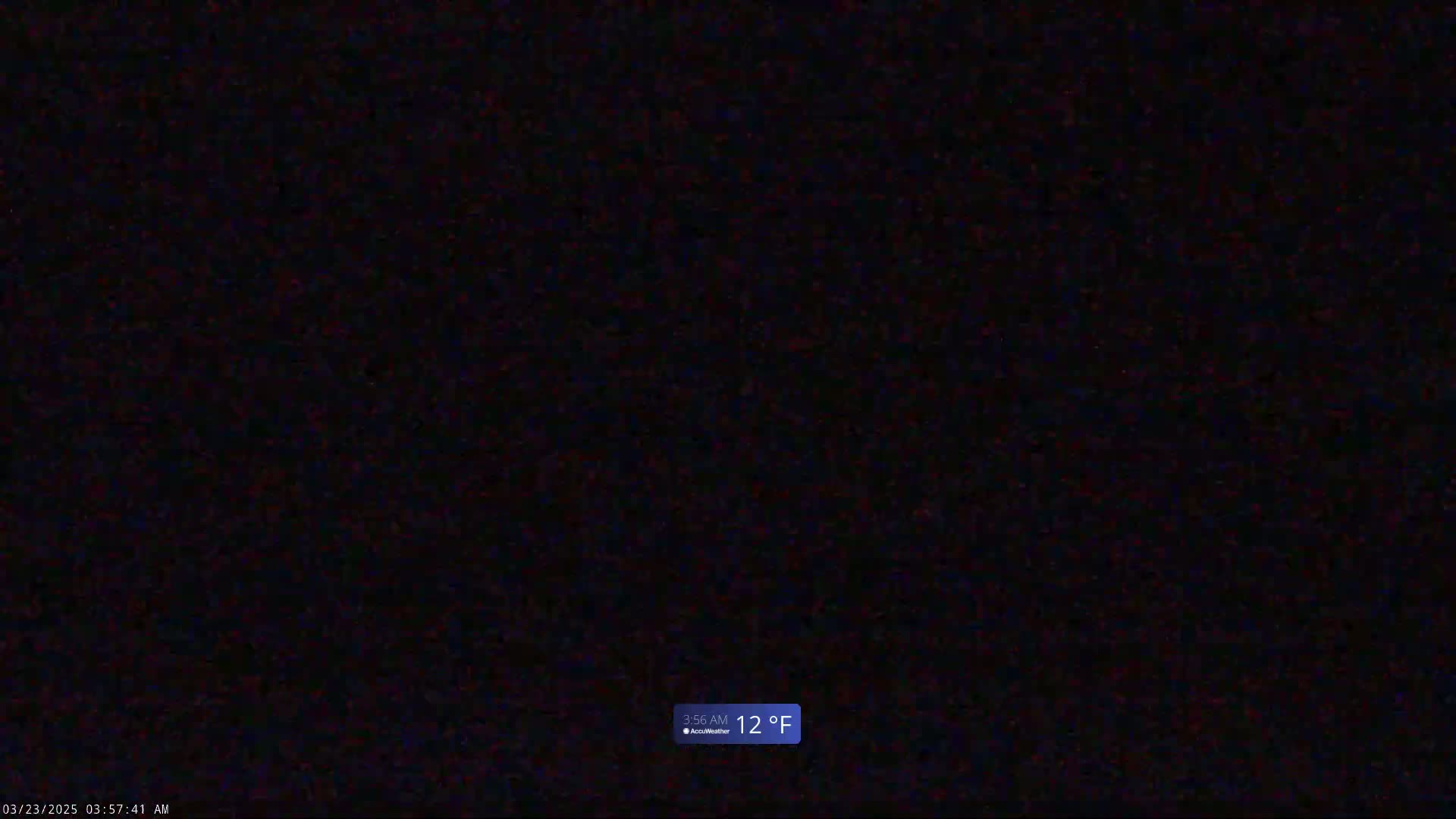 A completely dark image shows a nighttime outdoor scene at 12°F.