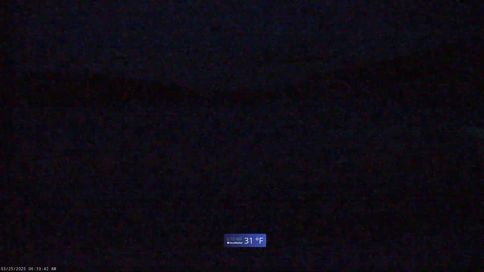 A dark, nighttime scene shows a mostly uniform black surface with a few slightly lighter areas, and the temperature is 31°F.