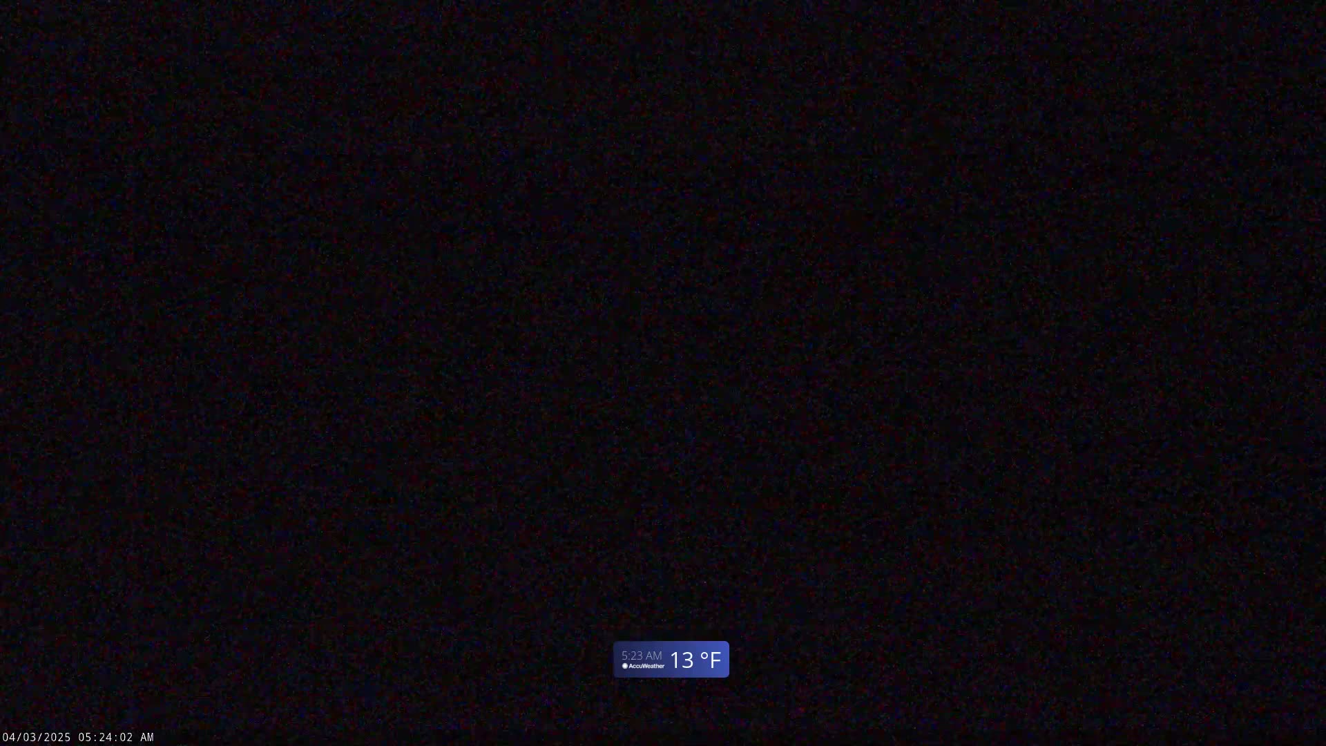 A completely dark image shows a nighttime scene with a temperature of 13°F.