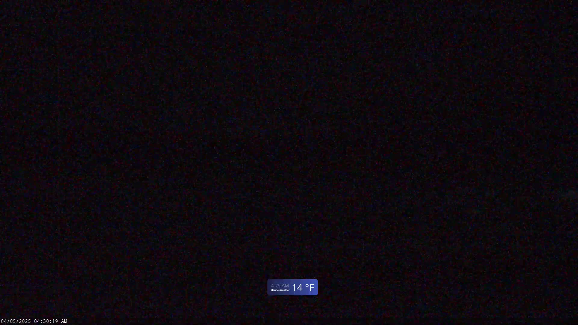 A dark, grainy image shows a nighttime scene with a temperature of 14°F.