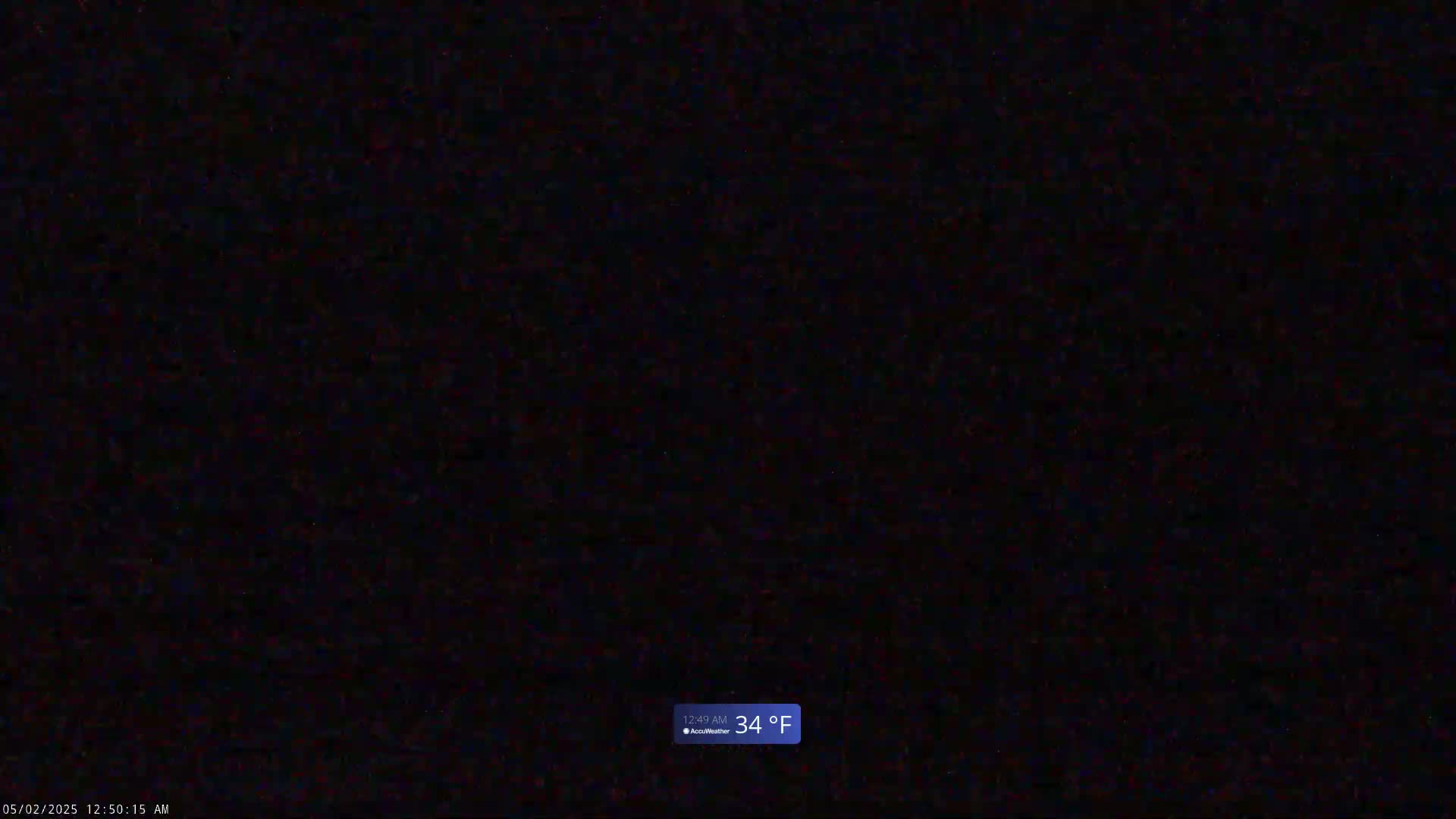 A completely dark image shows a nighttime outdoor scene with a temperature of 34°F.