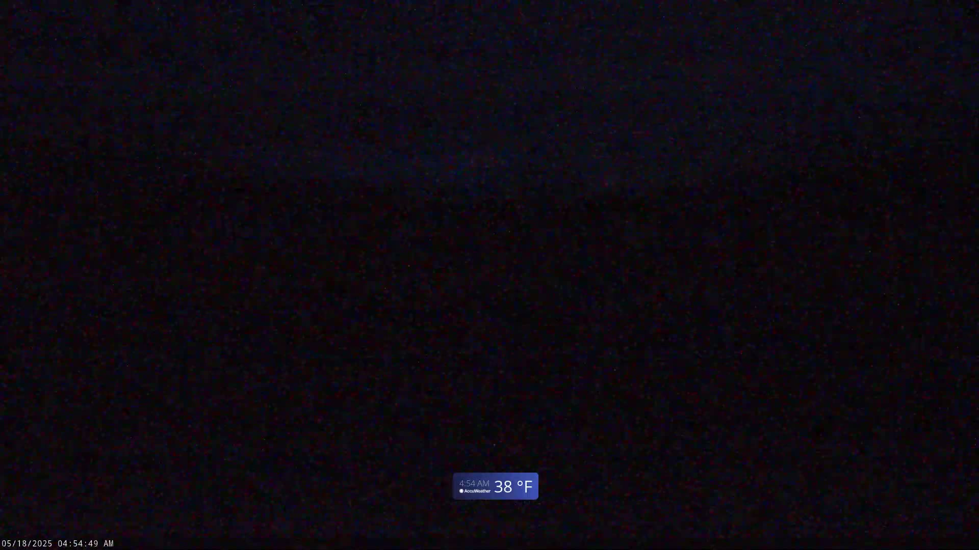 A dark, nighttime scene shows a mostly black sky with a temperature of 38°F.
