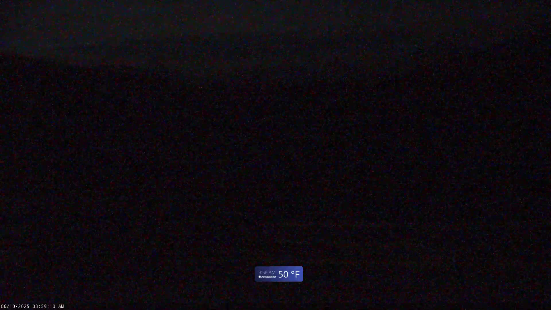 A dark, nighttime scene shows a 50°F temperature reading.
