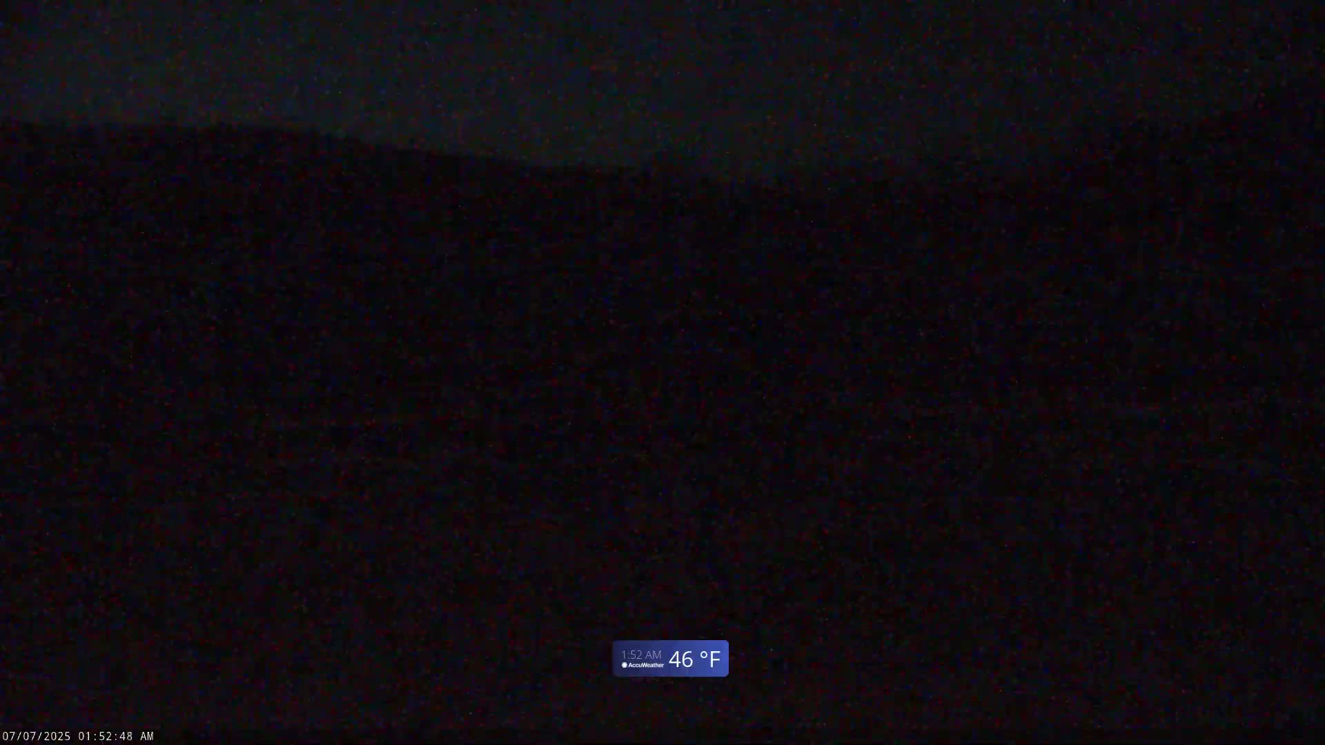A dark, nighttime outdoor scene shows a mostly indistinct landscape at 46°F.