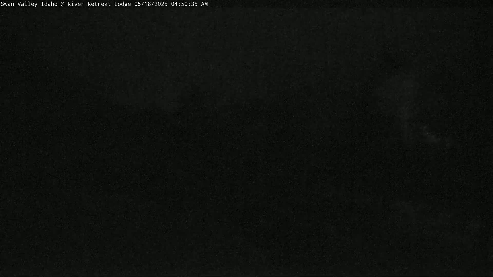 A completely dark image, possibly depicting nighttime conditions outdoors.
