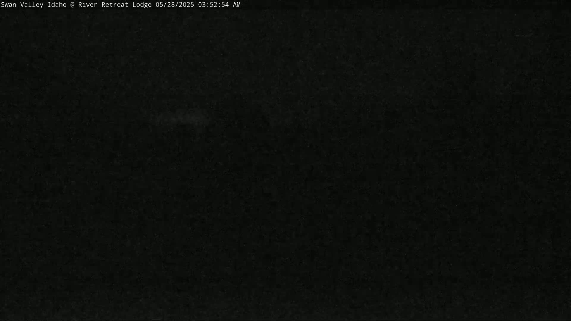 The image shows a completely dark scene at night.