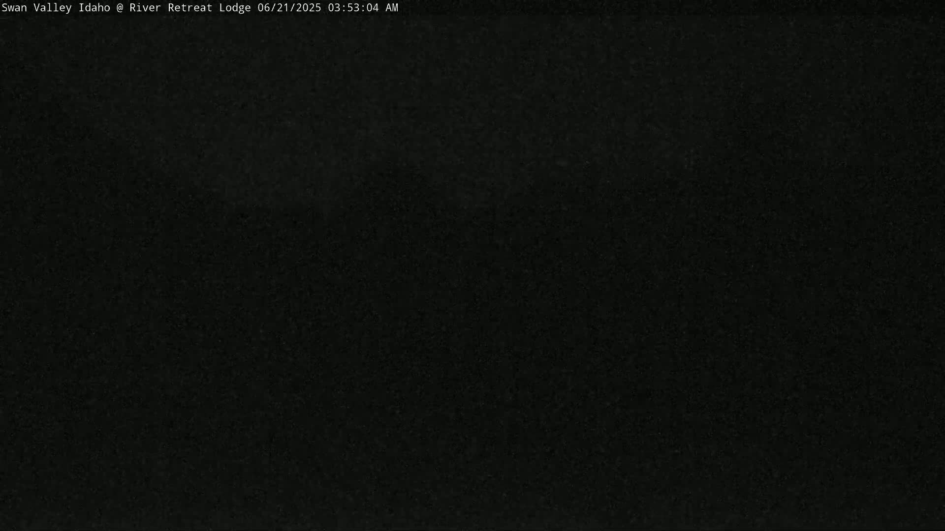 The image shows a completely dark, possibly nighttime scene.