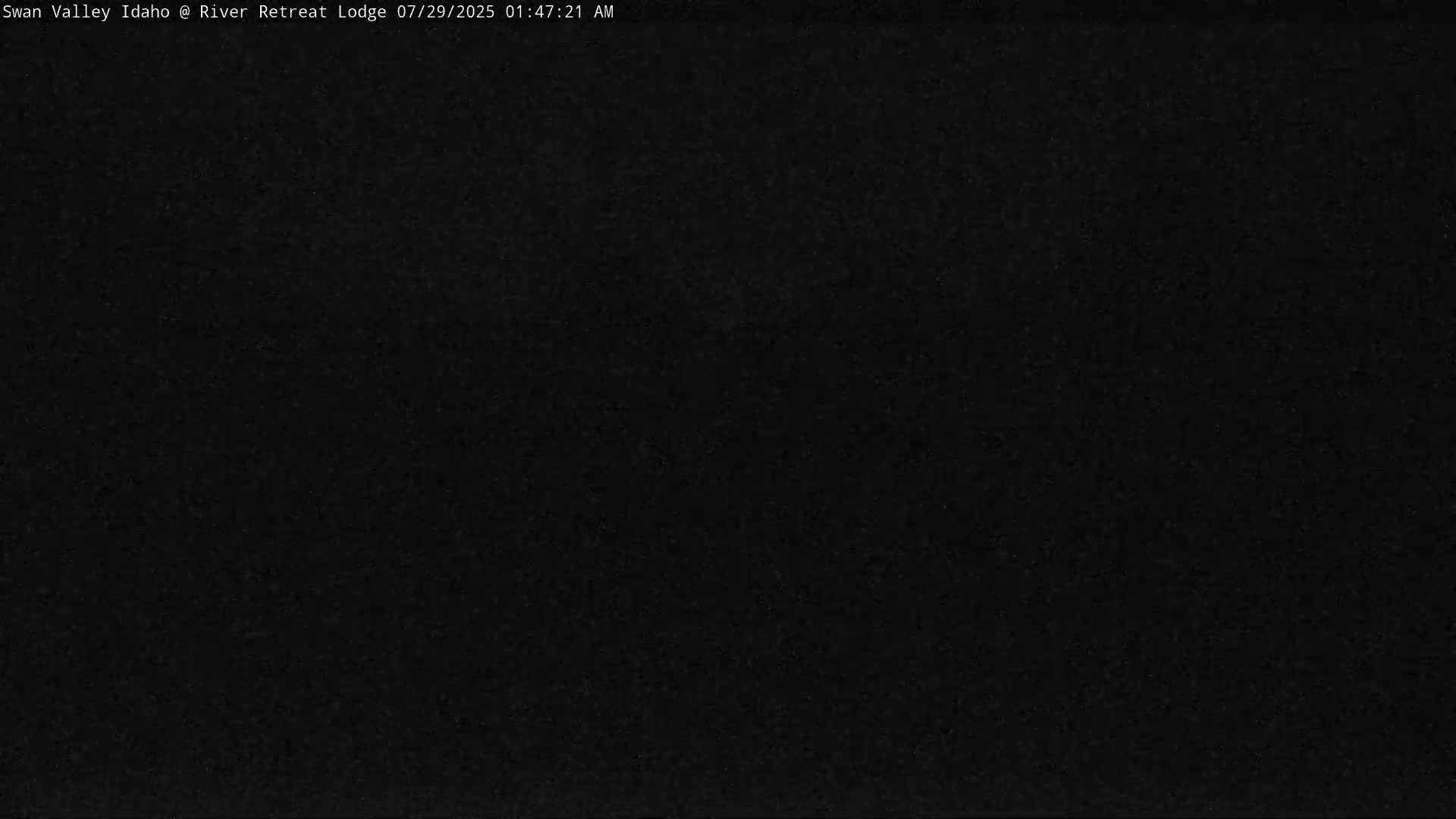The image shows a completely dark, grainy screen.