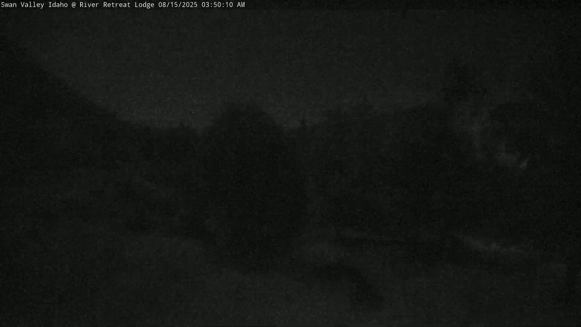 The image shows a completely dark, grainy screen.