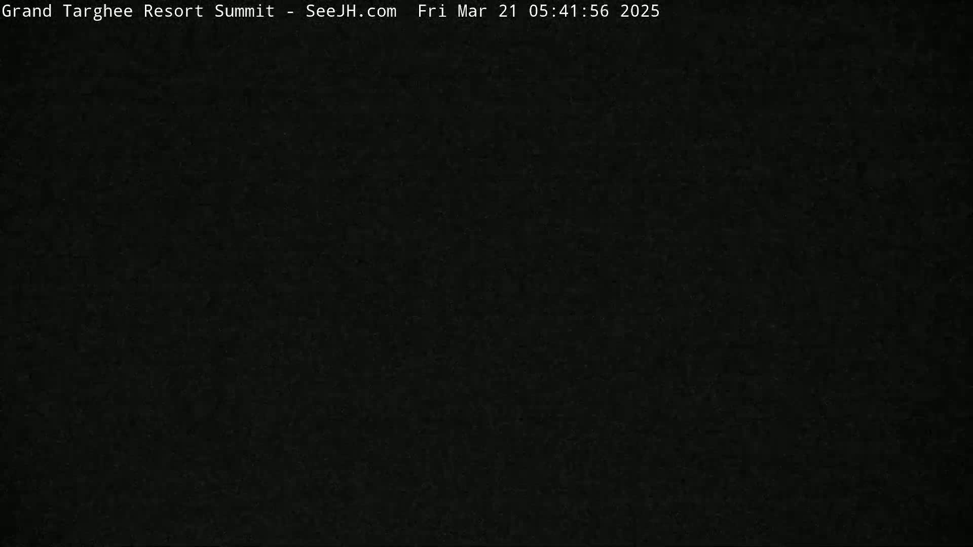 The image is a completely dark, possibly nighttime, view.