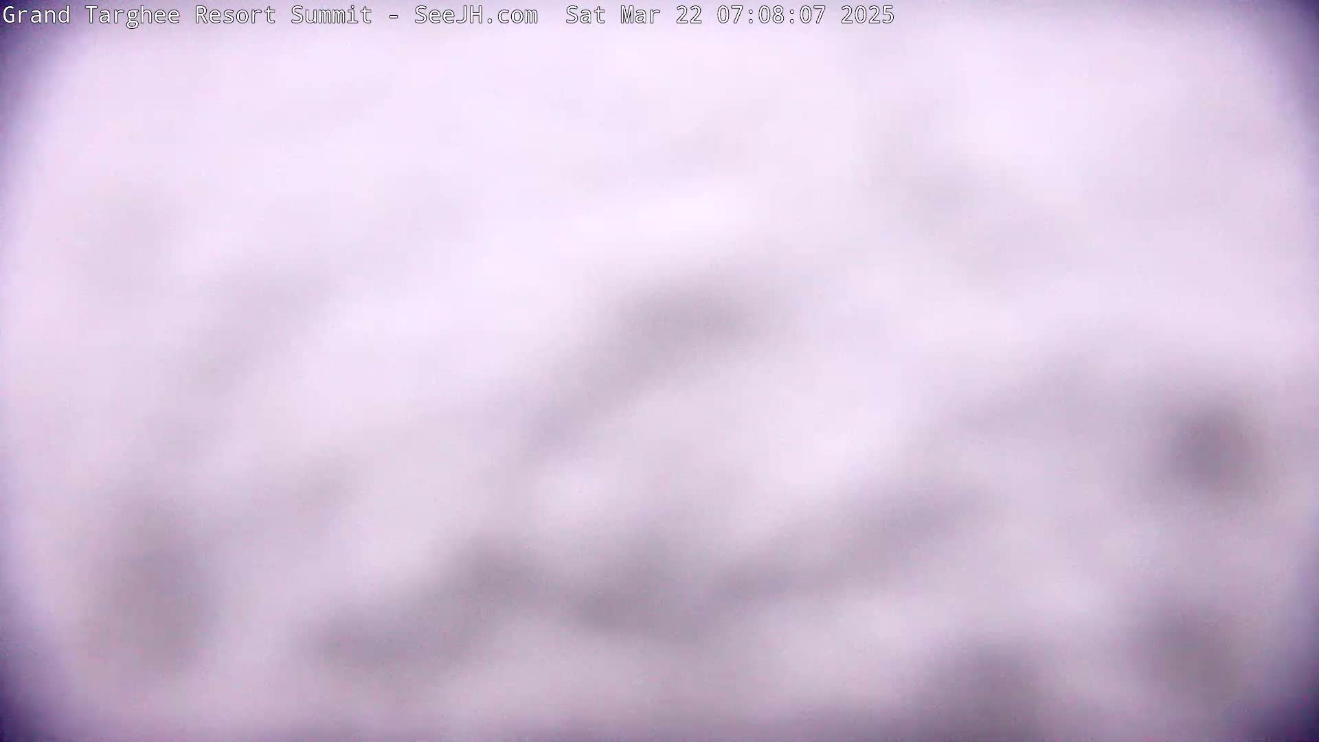A blurry, light-purple image shows an overcast sky.