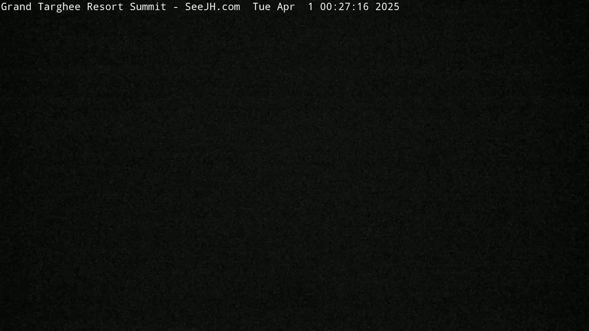 The image shows a completely dark, grainy view.