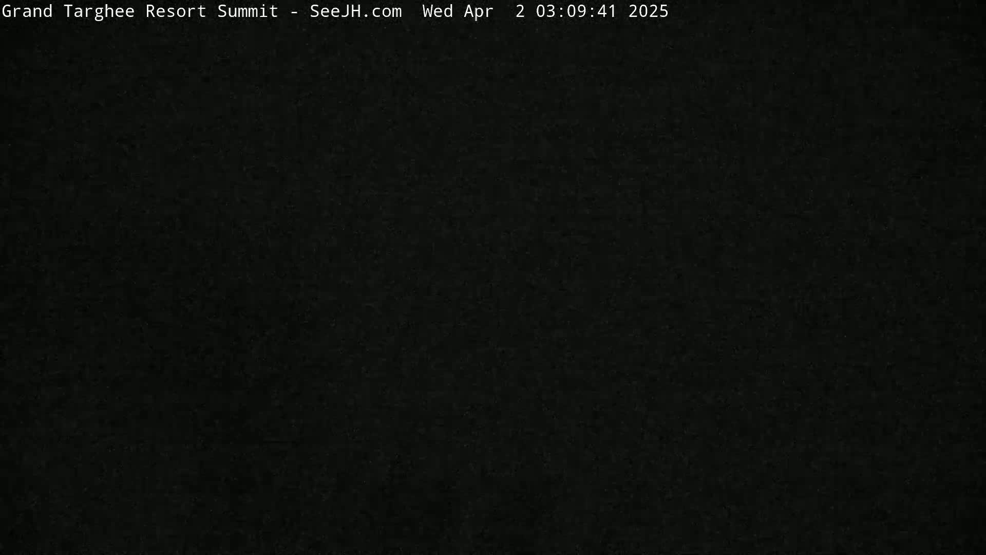The image shows a completely dark, possibly nighttime, outdoor scene.