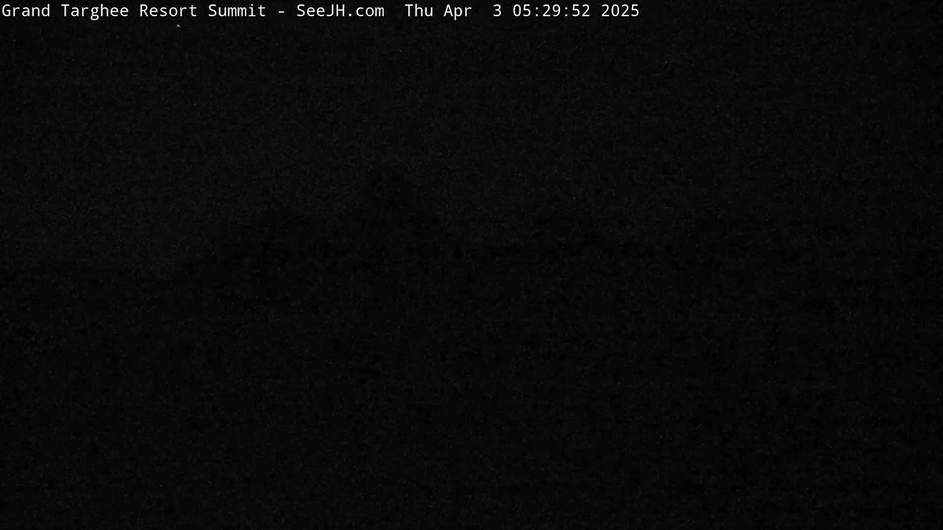 A completely dark image obscures any visible details.