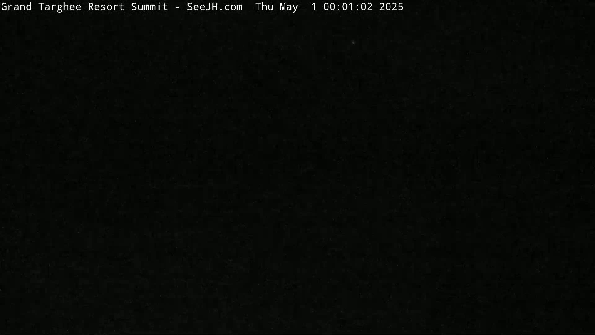 The image shows a completely black, dark scene.