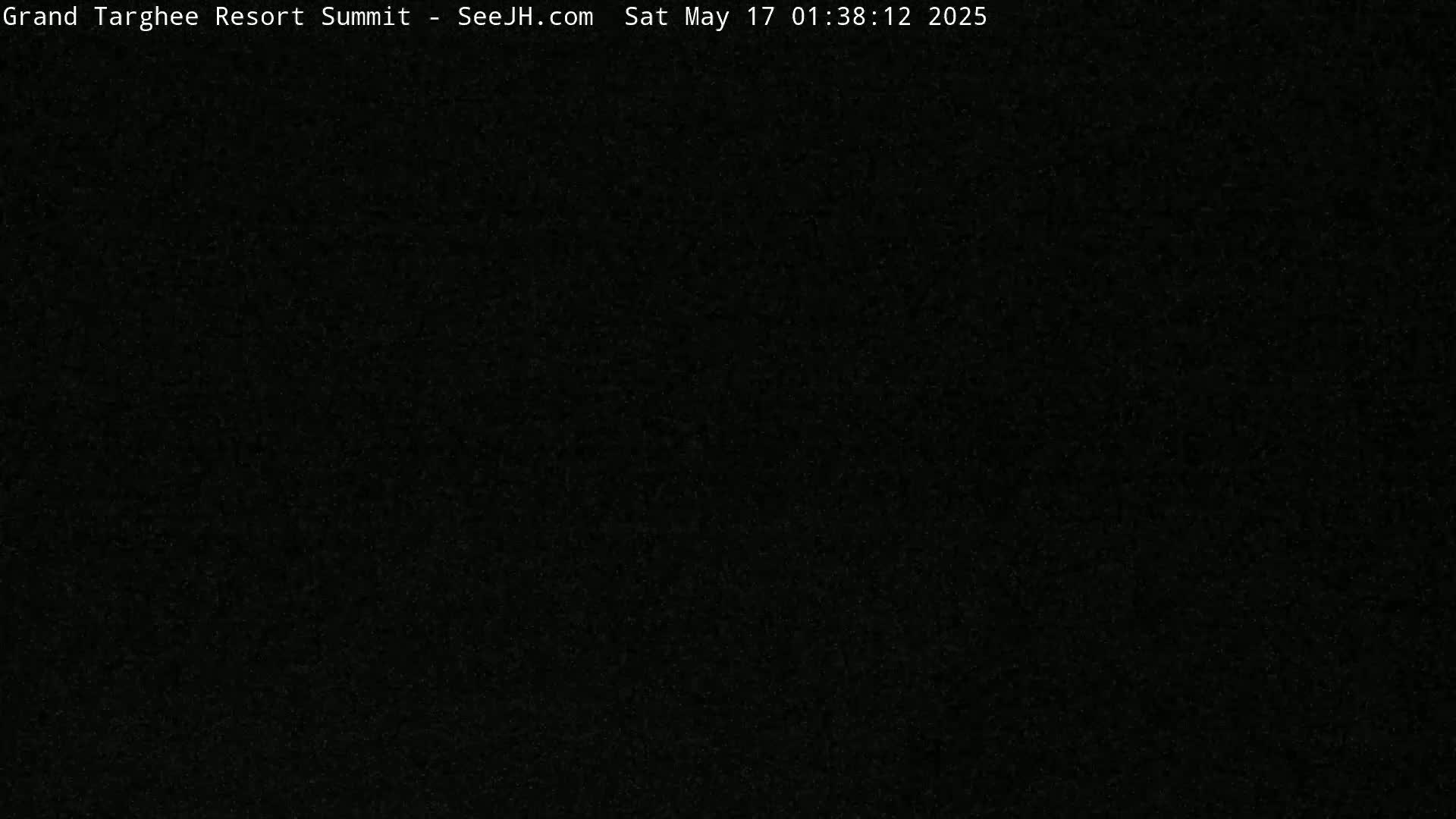 The image is a completely black, grainy screen.