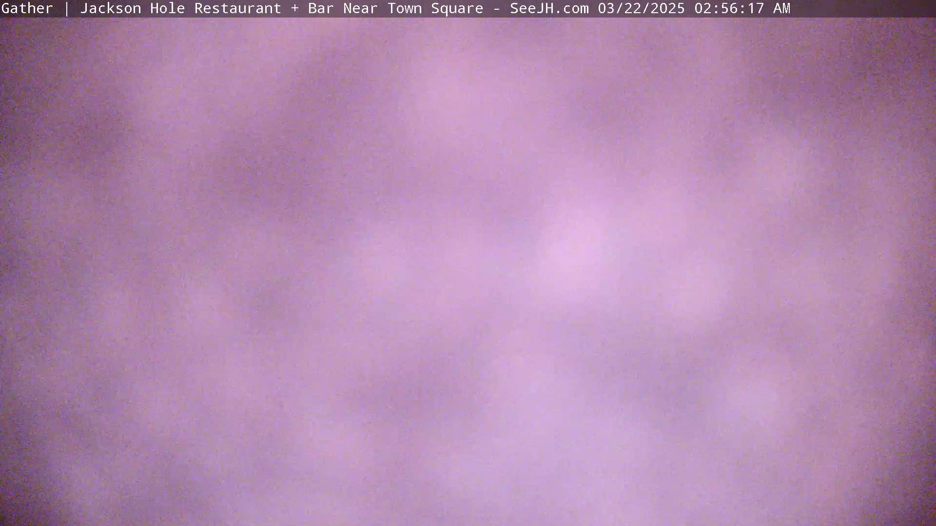 A blurry, lavender-toned image shows an overcast sky.