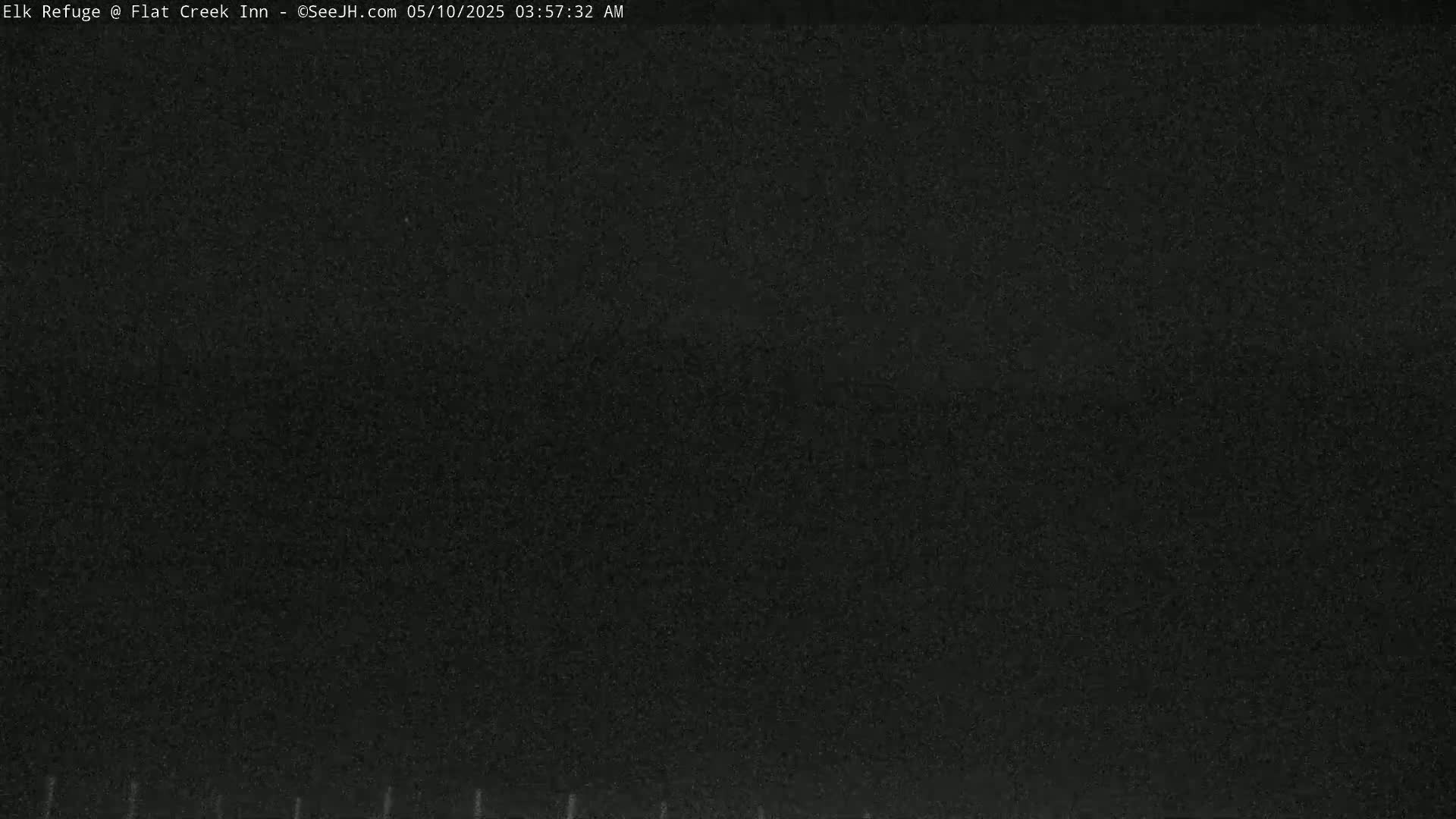 A completely dark image, possibly depicting nighttime conditions.