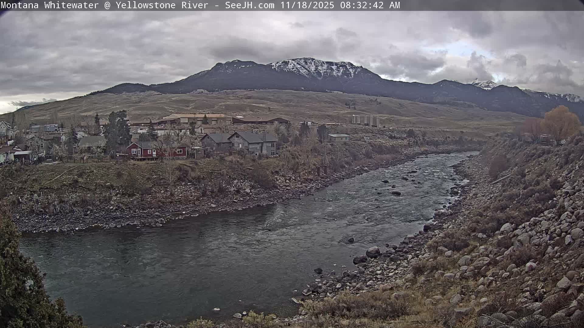 A nighttime long shot shows a line of faint lights in the distance against a dark, possibly overcast sky.