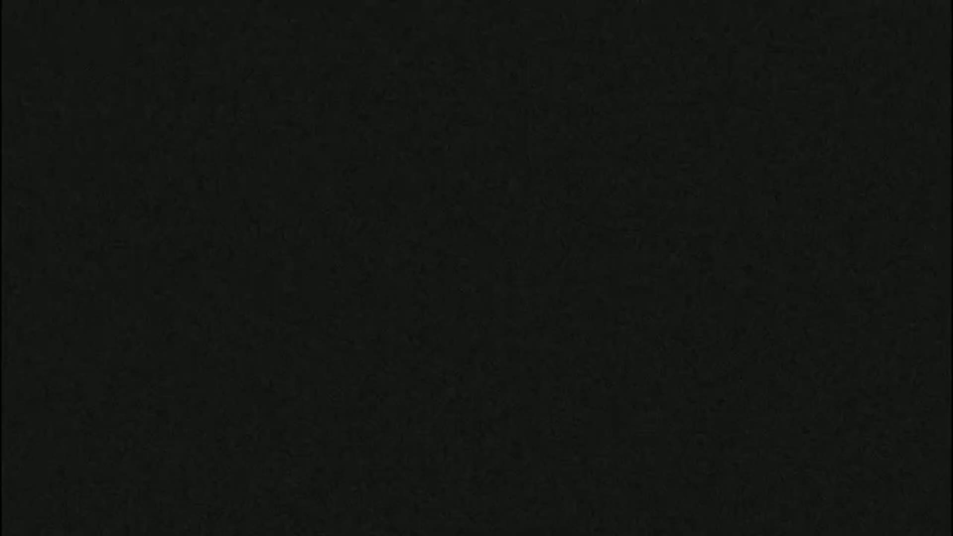 The image is a solid dark-grey/black textured background.