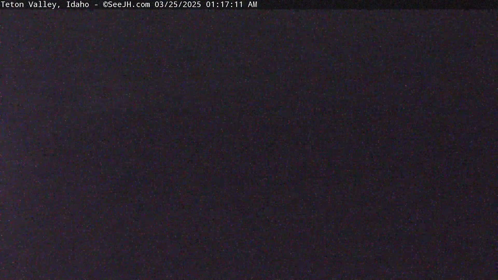The image shows a dark, uniformly colored area, possibly nighttime.