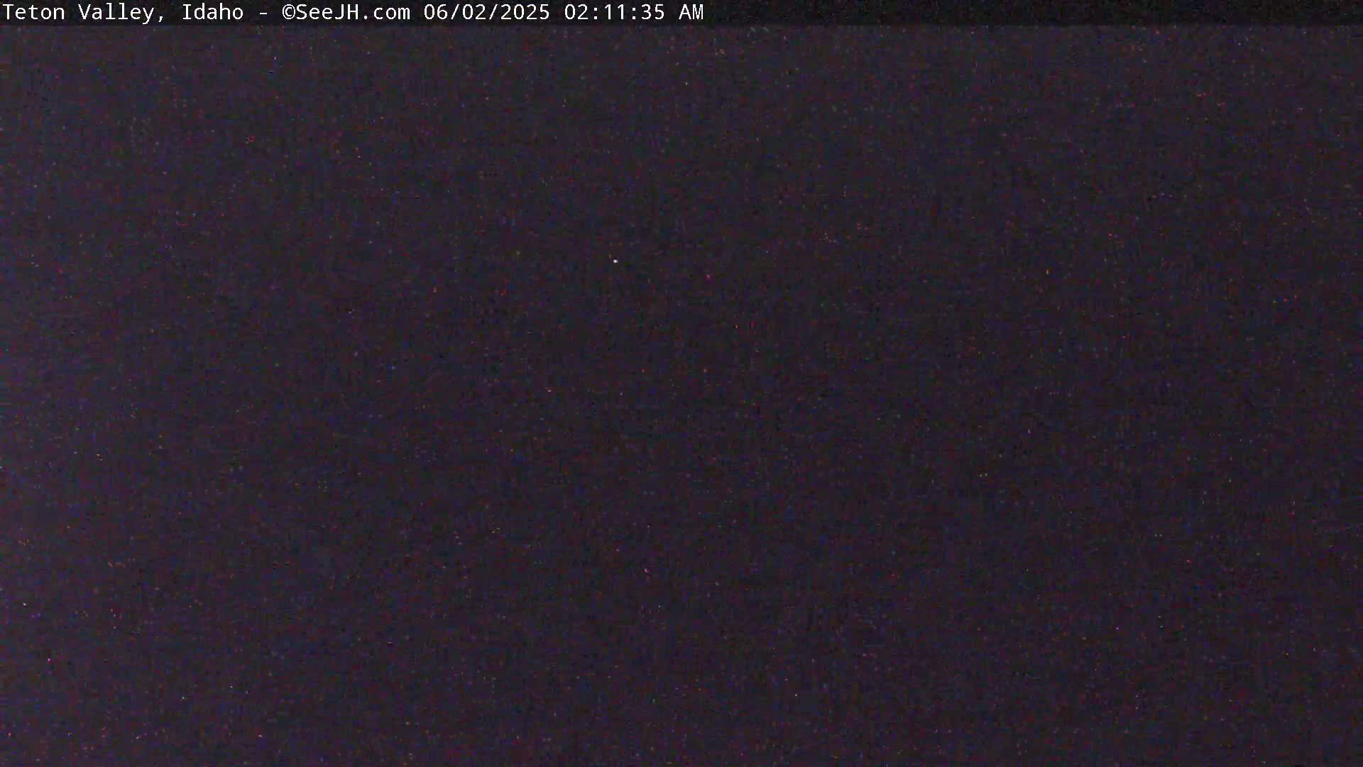 A dark, nighttime image shows a clear, star-filled sky.
