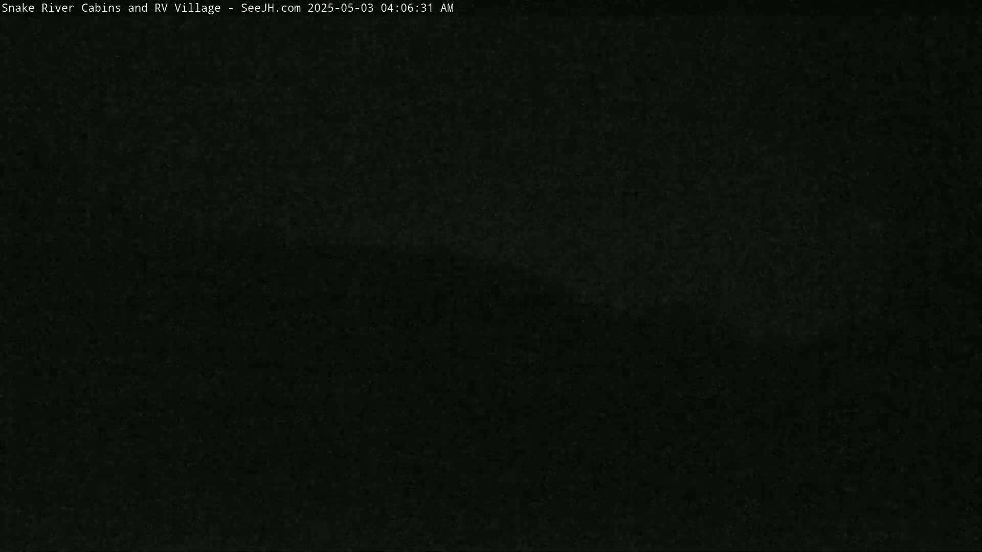 The image shows a completely dark scene at night.