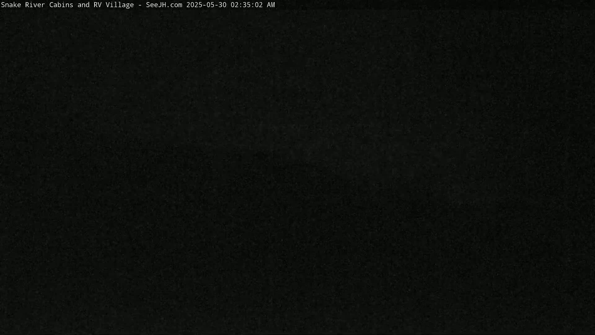 The image is a completely dark, grainy view.